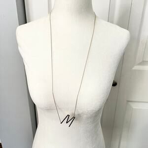 Long M Initial Necklace on a Gold Tone Chain